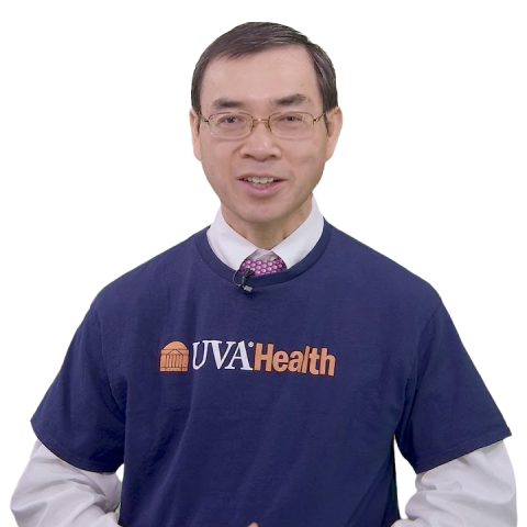 Zhiyi Zuo in a blue UVA Health t-shirt and white background