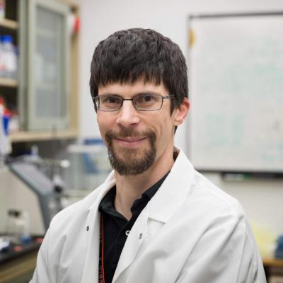 Alban Gaultier pictured in lab environment with white lab coat